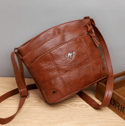 Toli vintage leren schoudertas met ruim en georganiseerd ontwerp