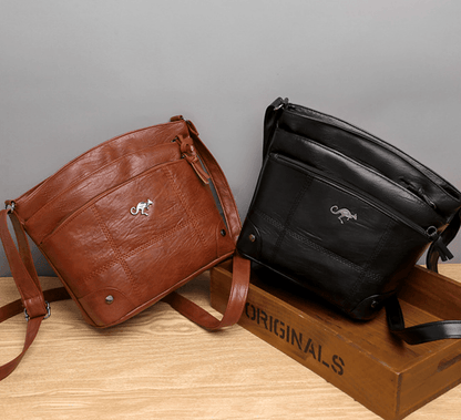 Toli vintage leren schoudertas met ruim en georganiseerd ontwerp