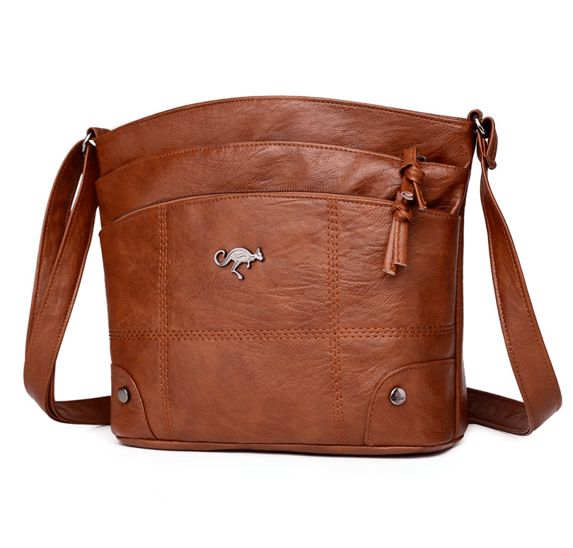 Toli vintage leren schoudertas met ruim en georganiseerd ontwerp